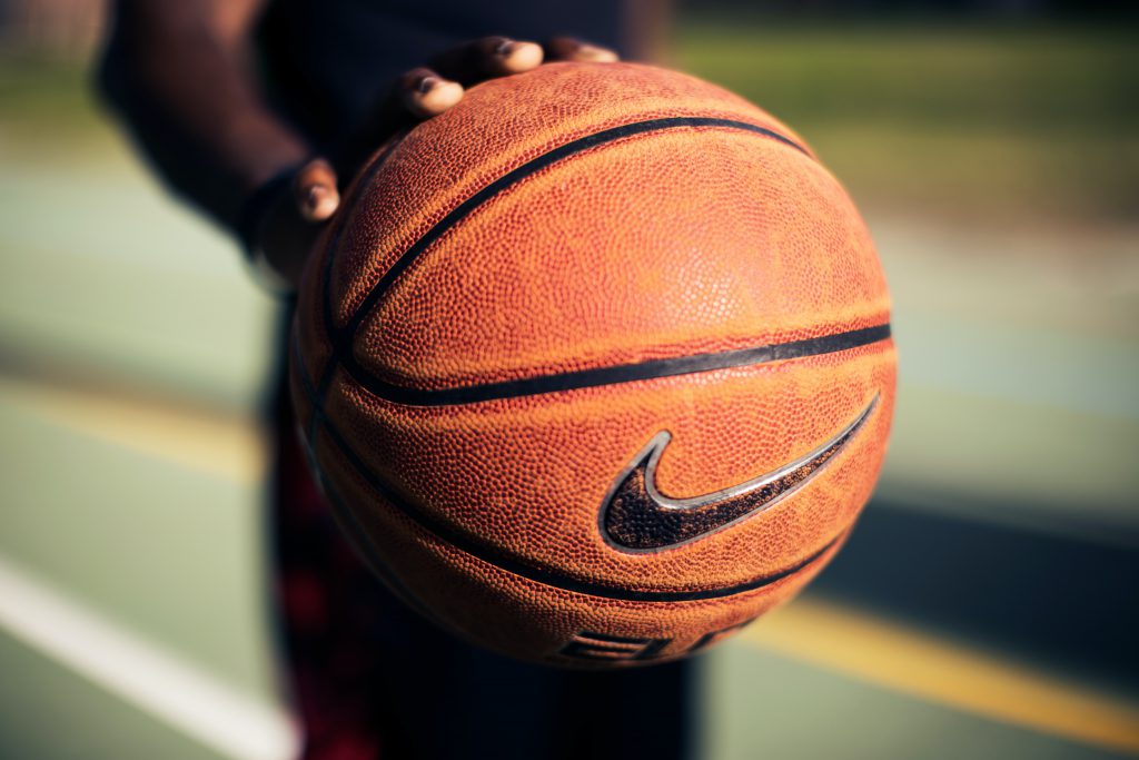 basketball player holding nike basketball swoosh