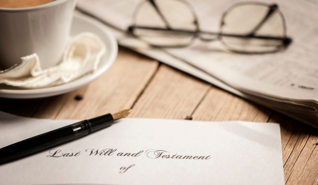 Last will and testament with cup and glasses