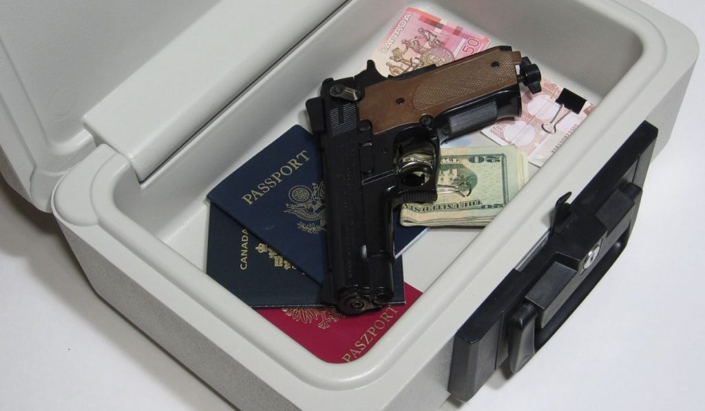 gun and passports inside the storage box