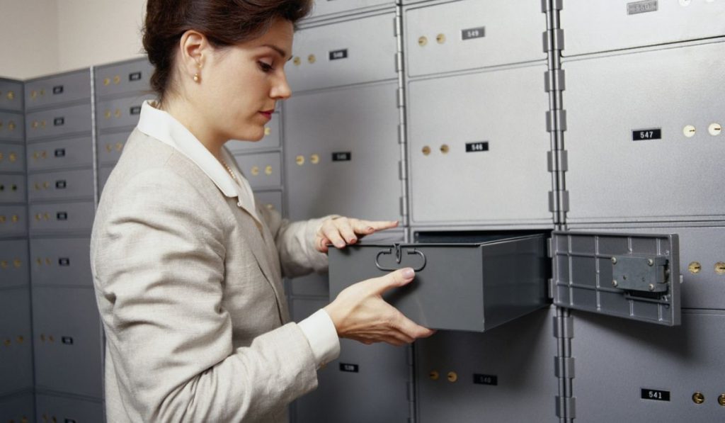 lady holding the safe deposit box