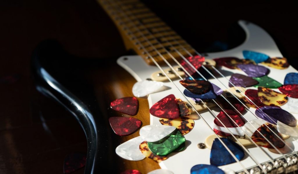 guitar with a lot of guitar picks